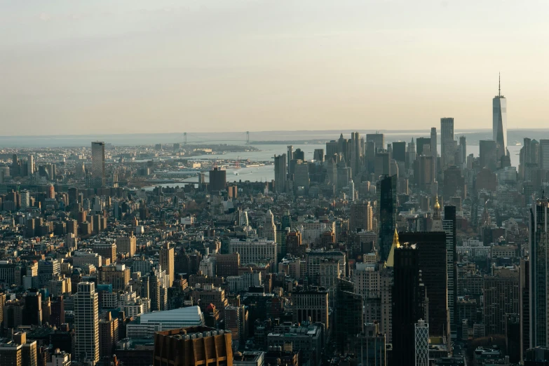 a view of the empire building and lower east river from top of rockefeller