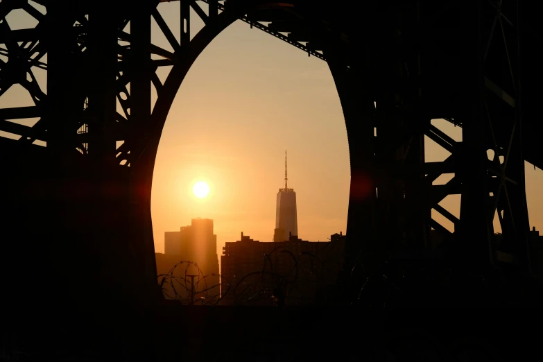 the sun is setting over a large city