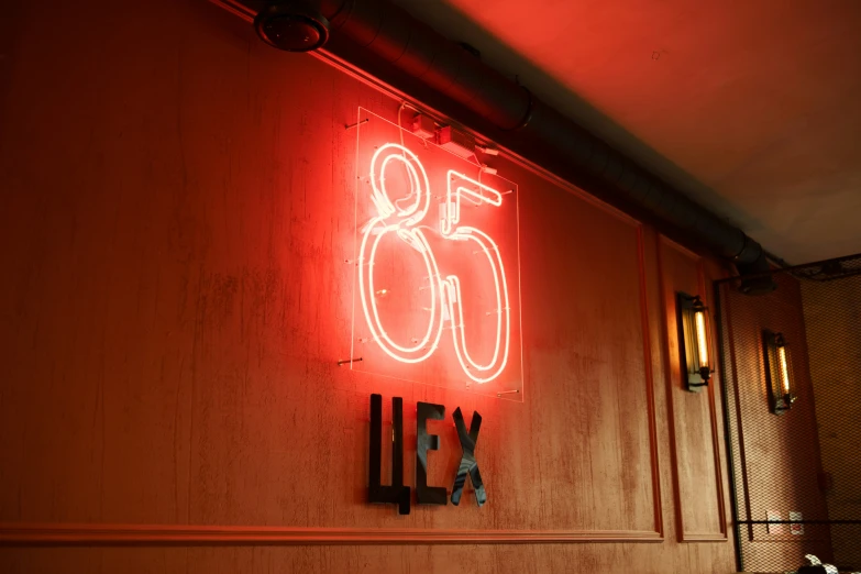 a neon sign on the wall stating that you are very old