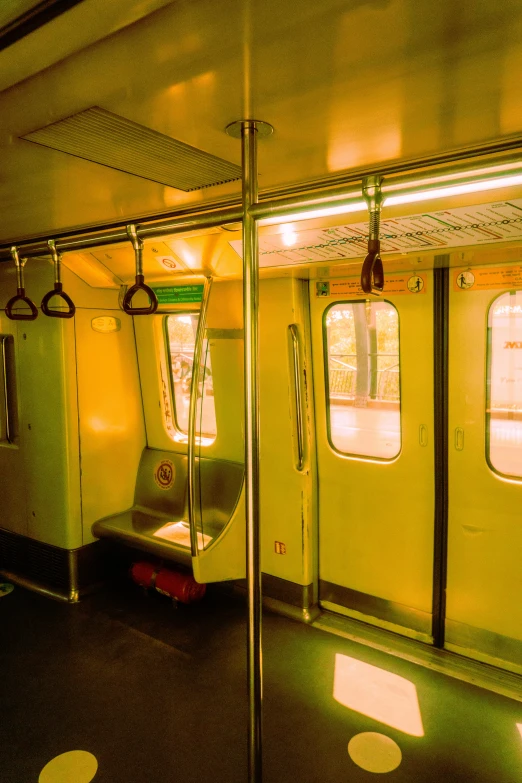 an empty train car with many windows and light fixtures