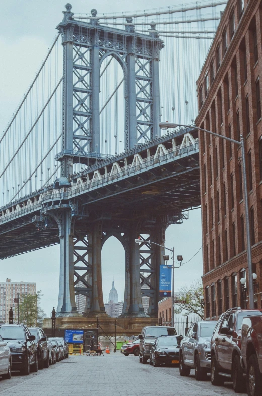 a bridge spans over an urban area as traffic passes below it