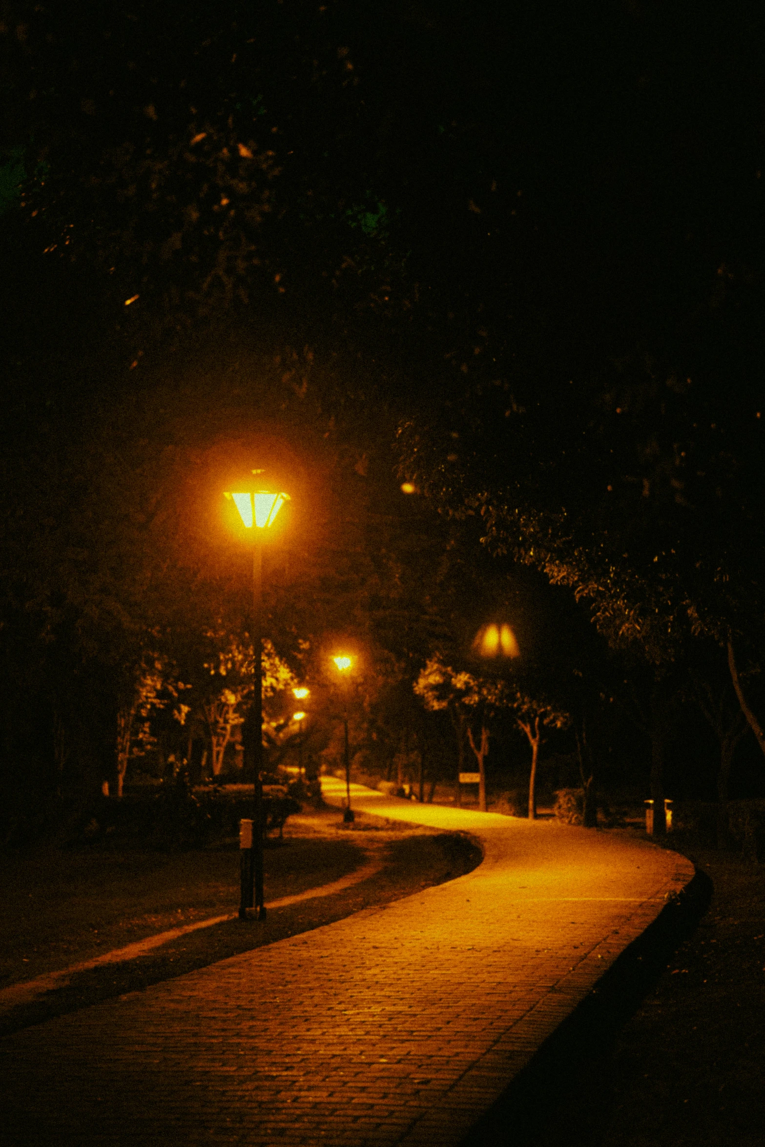 light shines brightly on an empty street at night