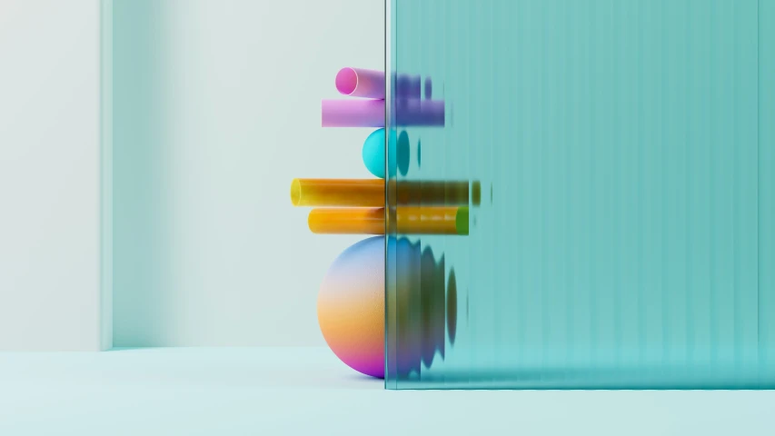 some colored objects against a glass window with a green background