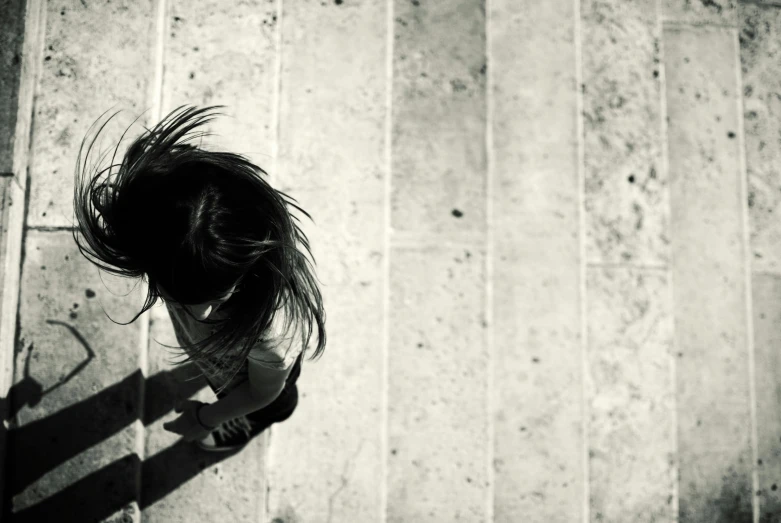 a woman's shadow is shown on the floor