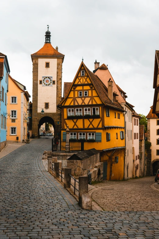 an old european village street that shows off the color yellow