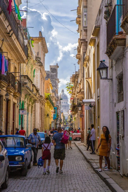 a group of people walking down a city street