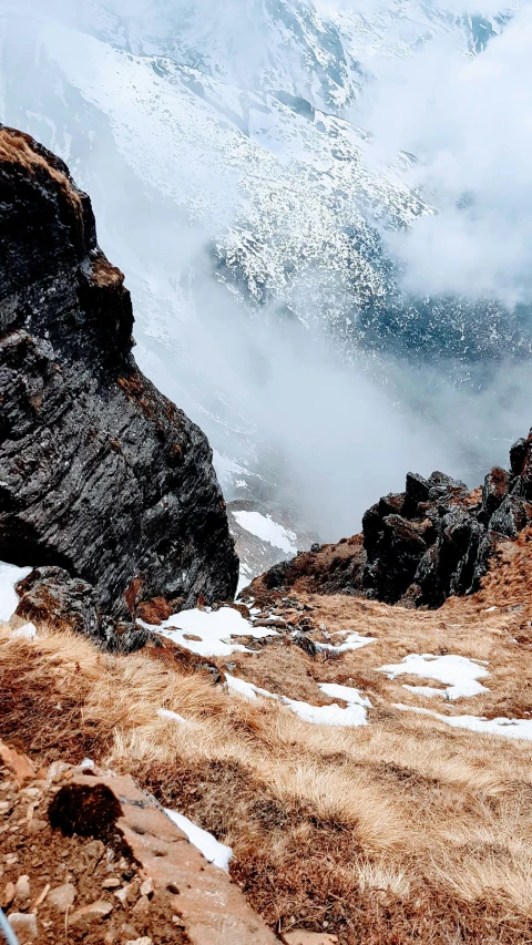 a picture from the top of a mountain with snow on it