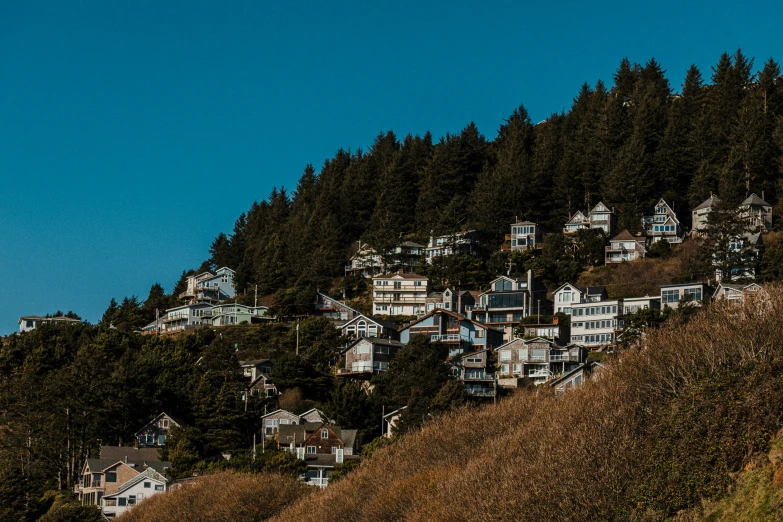 the houses are sitting on a steep hillside