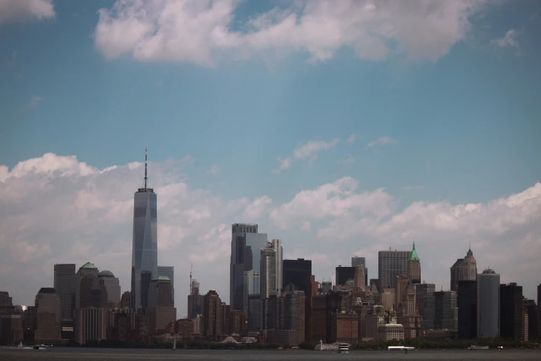 a large city with skyscrs sitting across the water