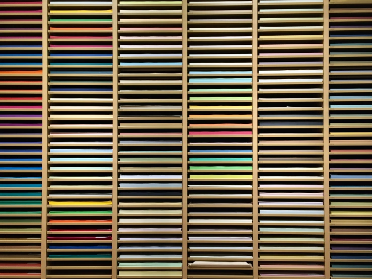 a large book case full of color samples