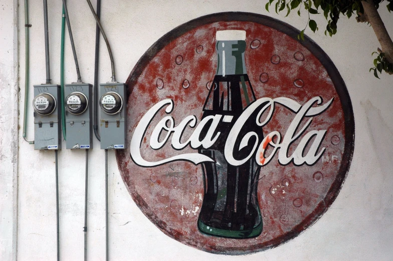 a coca cola sign on the side of a building