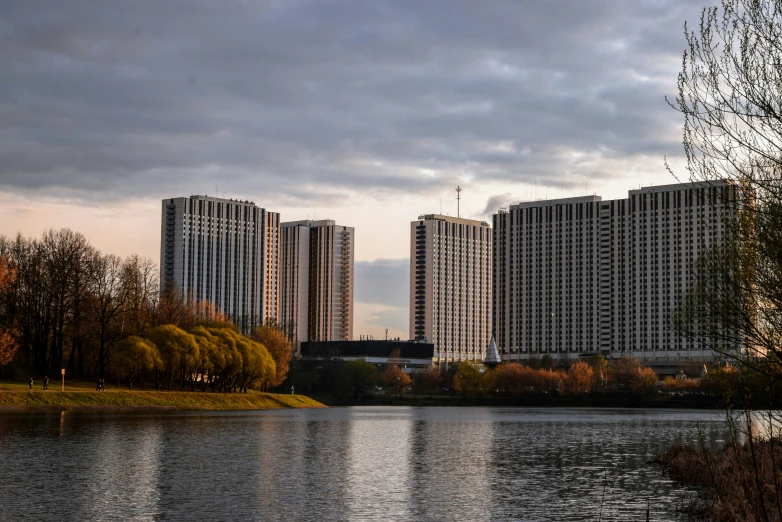 there are high rise buildings in the back side of the river