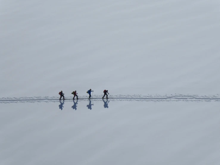 a group of people hiking through a field