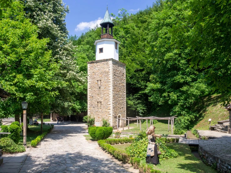 there is a clock tower in the middle of this park