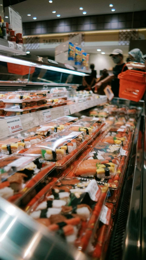 the shelves in the store are filled with sushi