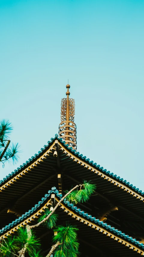 a view of a large roof and a clock tower