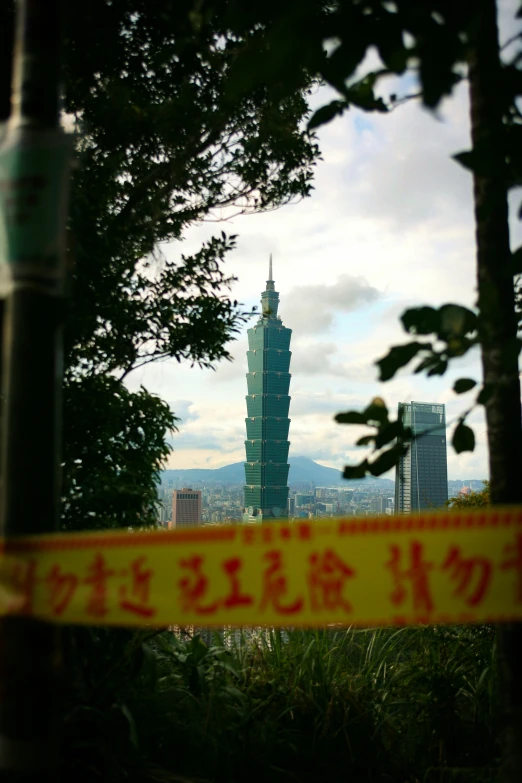 yellow caution tape with chinese writing underneath