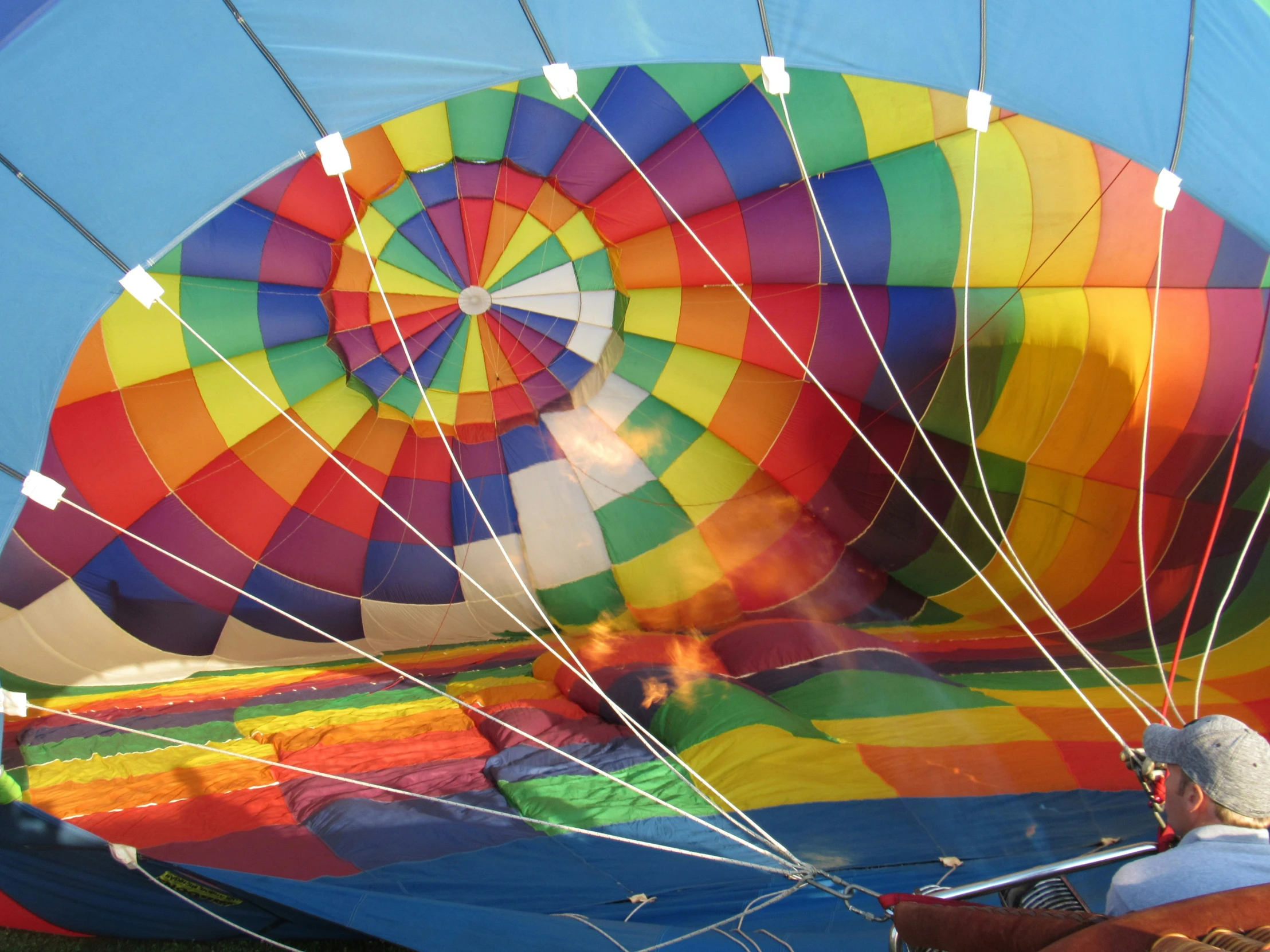 a  air balloon in the sky with a man in front of it