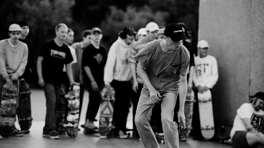 black and white pograph of a skateboarder skating