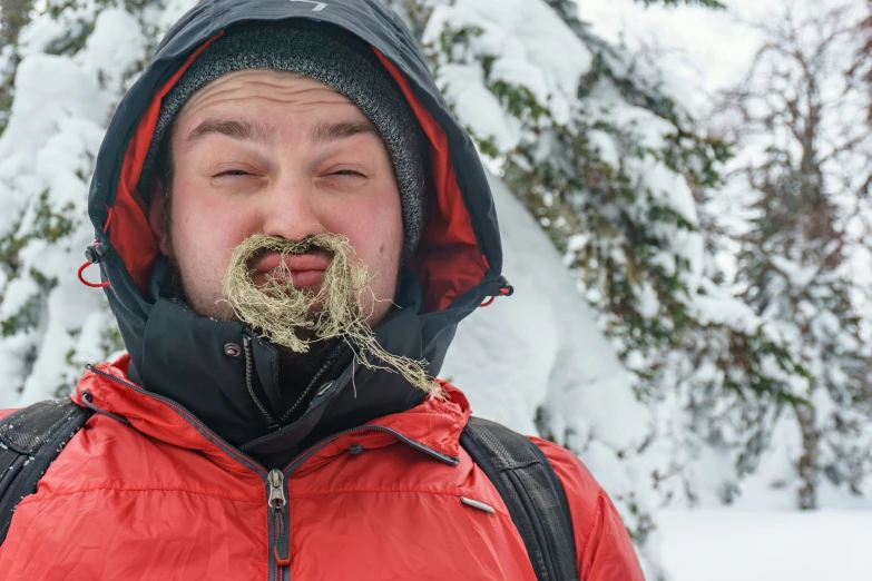 a man is covered with gold flecks in his mouth