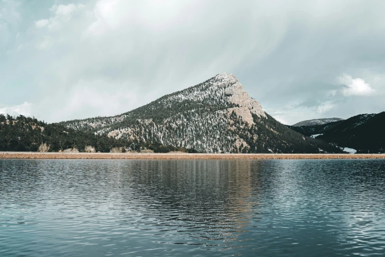 a mountain and a lake with some water around it