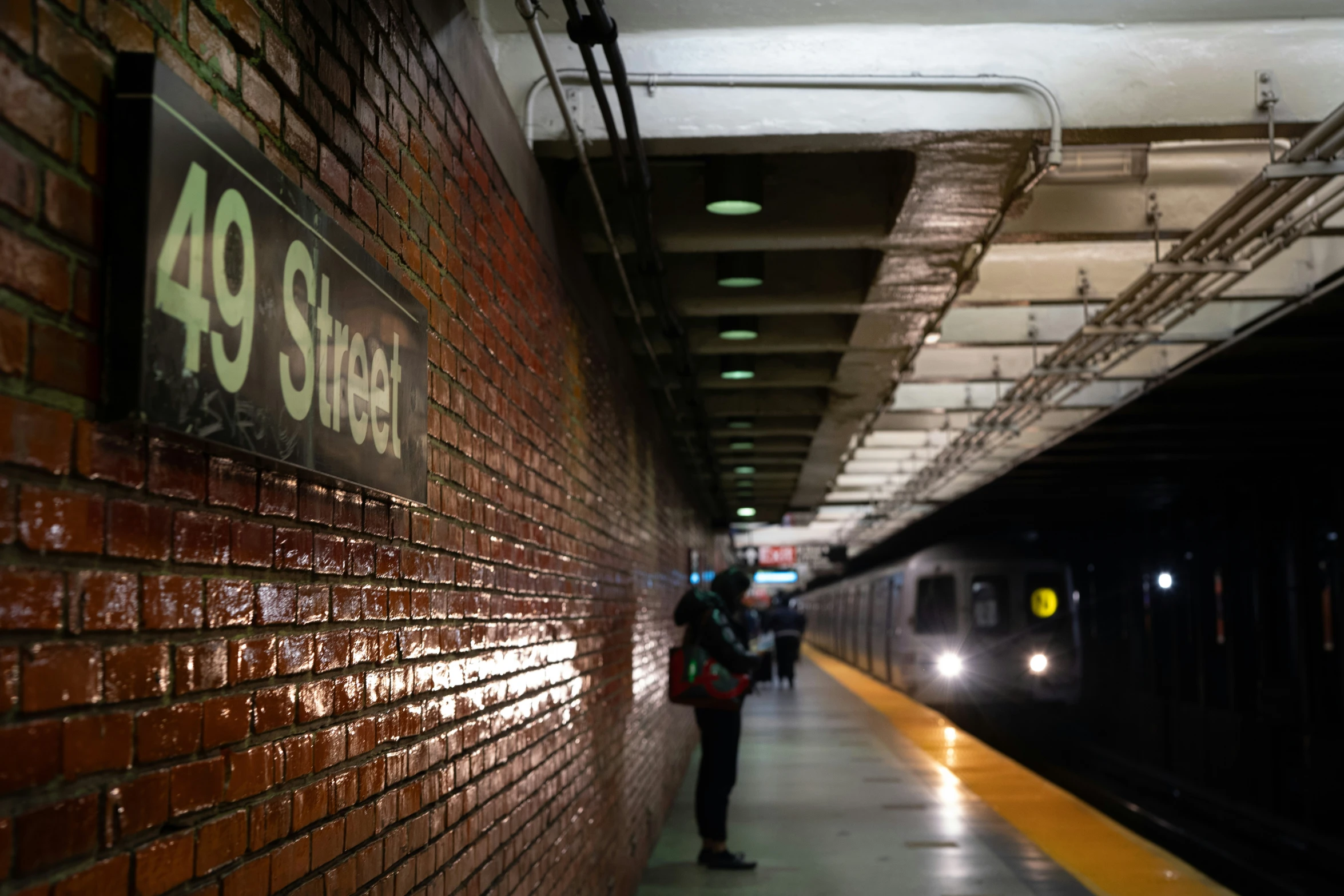 people are waiting for the subway to change it