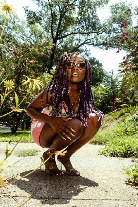 a woman squatted on the ground with her eyes closed