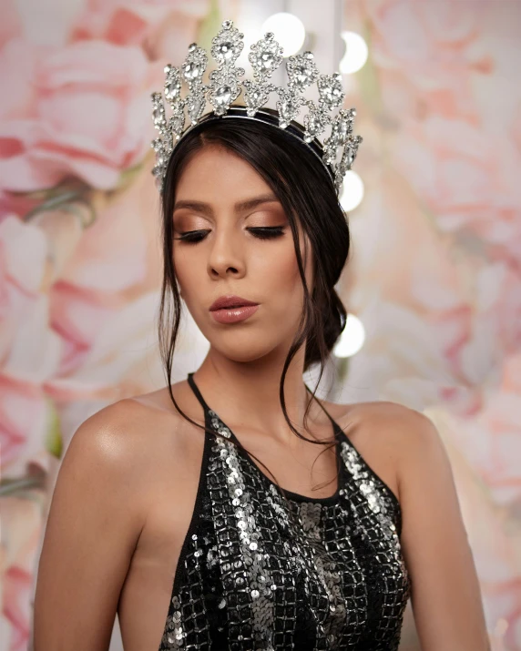 a woman wearing a crown made out of sequins