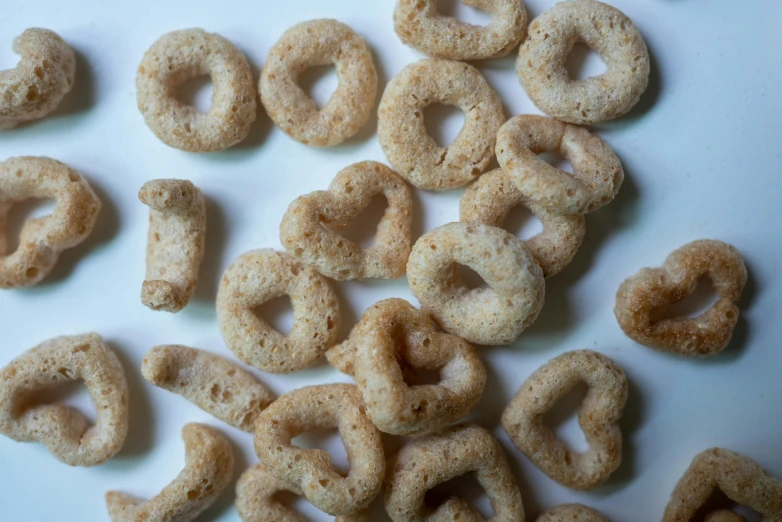 lots of homemade donuts are mixed into little loops