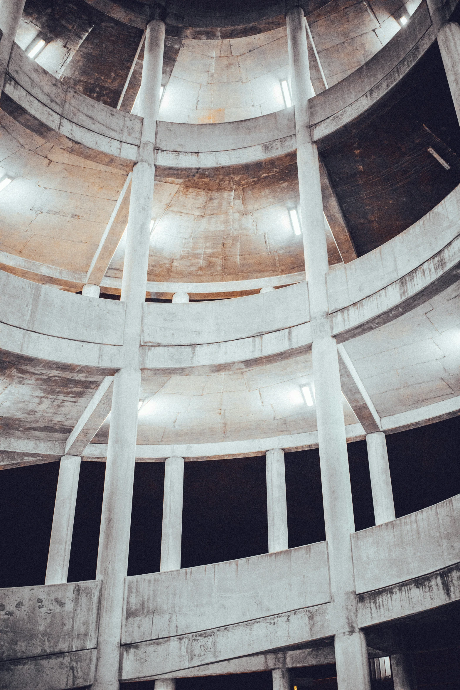 the circular room has several white pillars in it