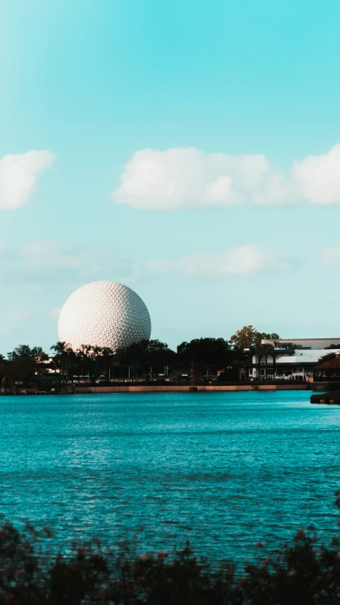 a lake with a big object in the middle of it