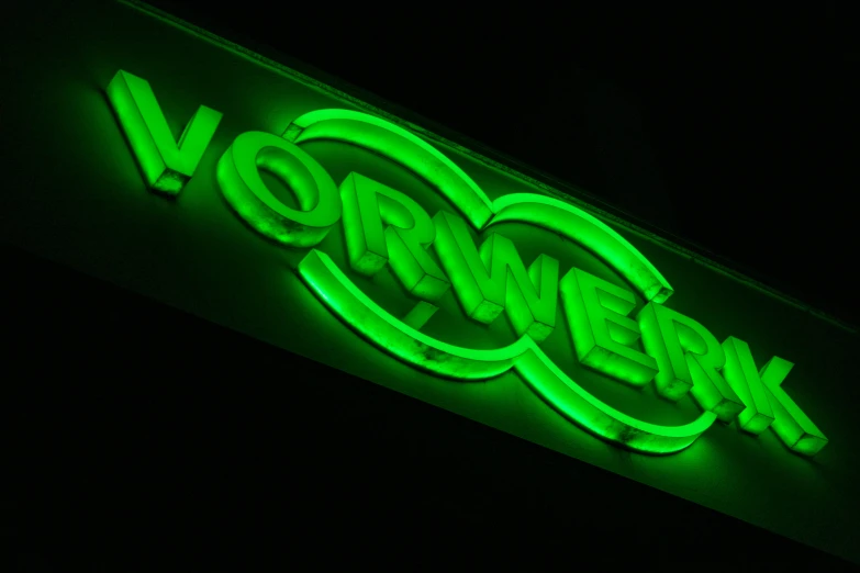 green neon sign that says vyr week in black background