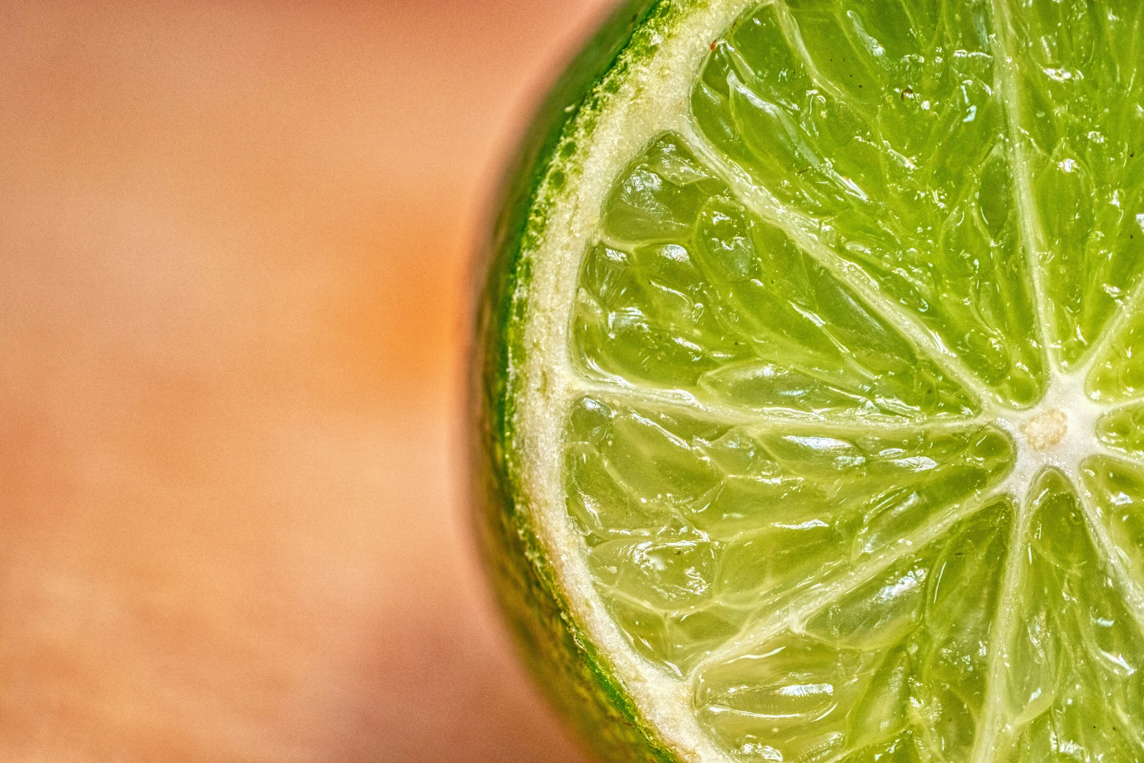 a sliced lime on a wooden surface