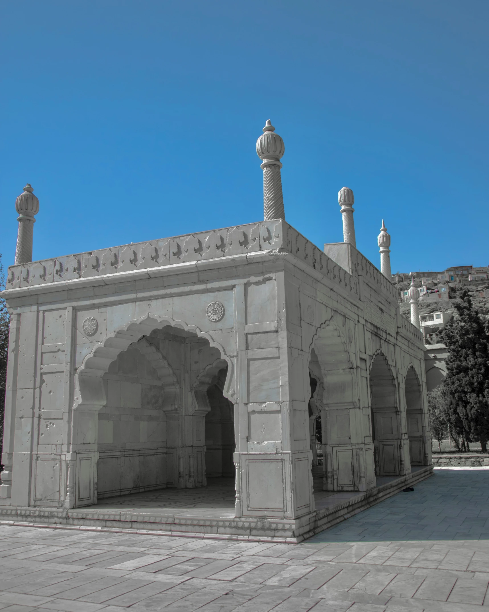 an oriental styled mosque built around an arched passageway