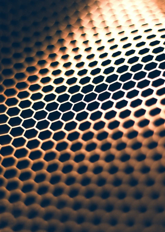 a view of a black and yellow hexagonal object