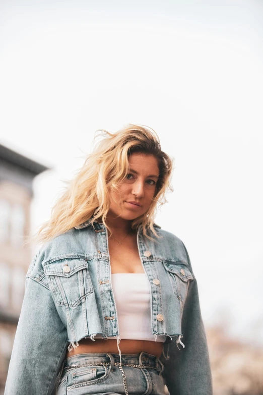 there is a very young woman standing in the street