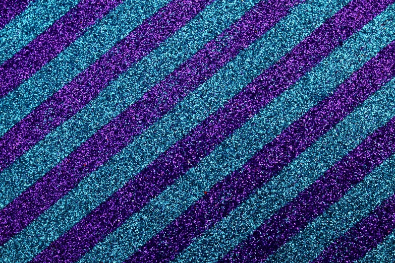 a pink and blue striped wallpaper background that is slightly vertical to the camera