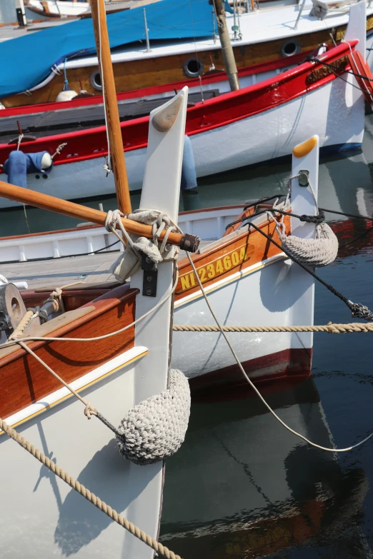 a boat with ropes attached to it is docked