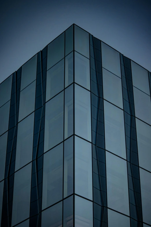 large blue building with vertical striped glass windows