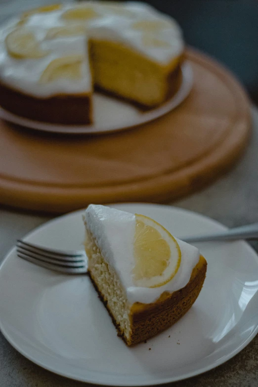 two plates with slices of cheese cake on them