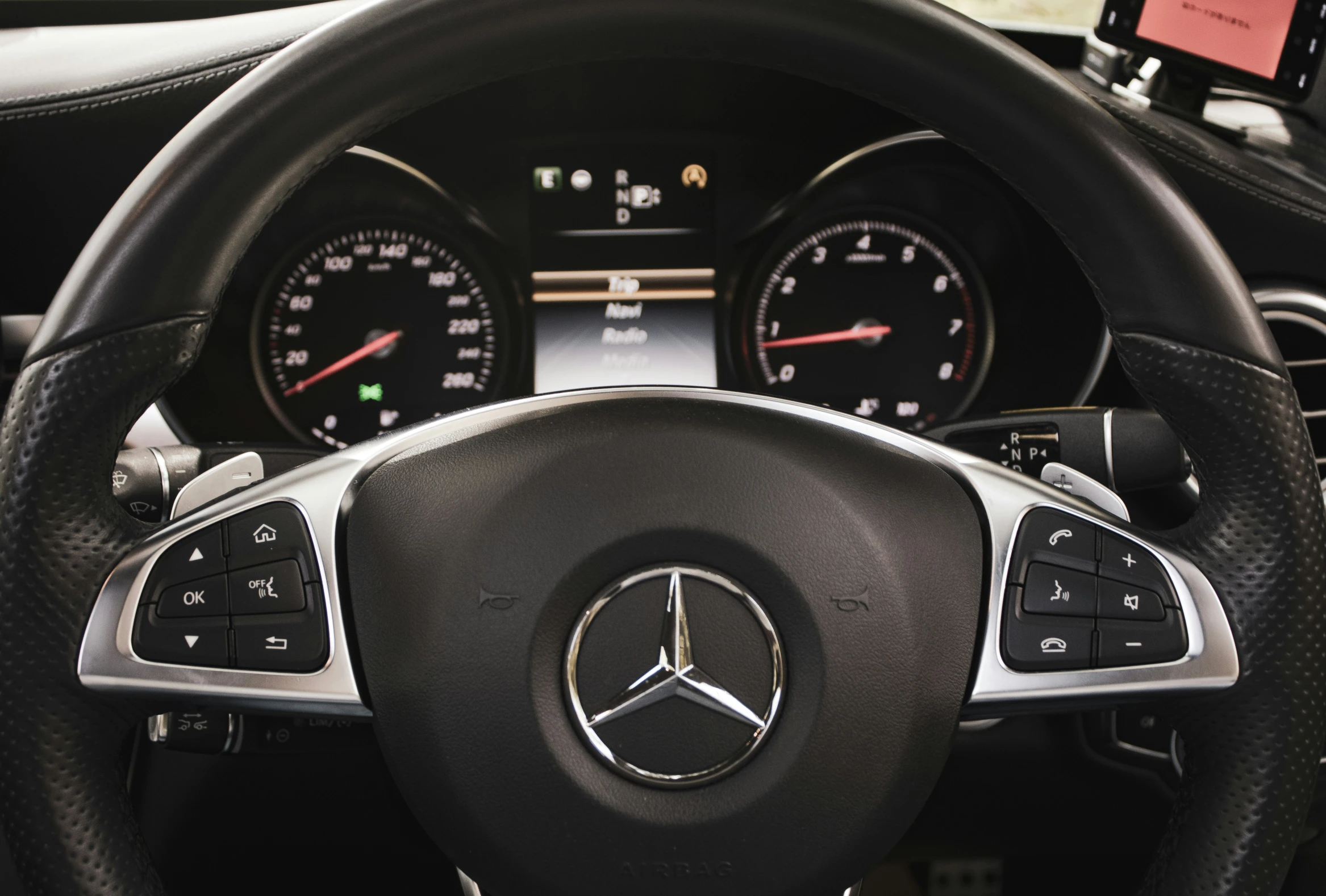 steering wheel view of a mercedes car in color