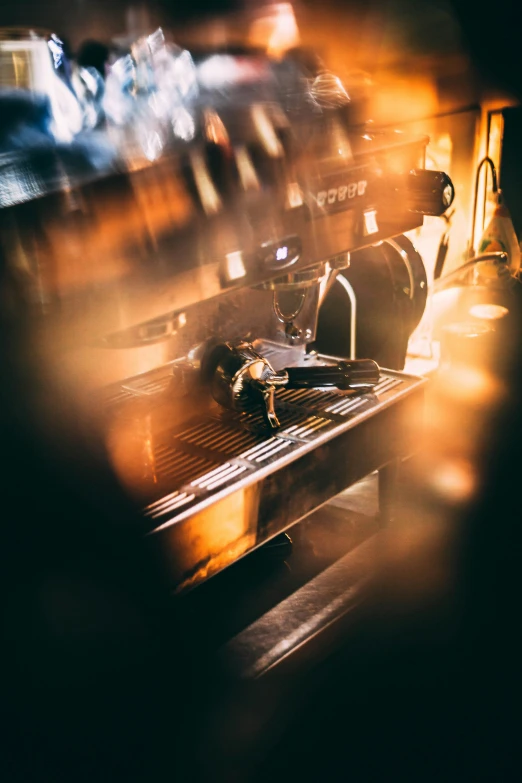 an old coffee maker in motion on the counter