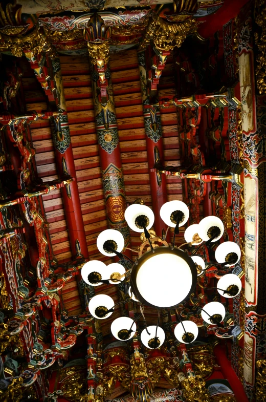 the view from above, of a circular mirror on the ceiling