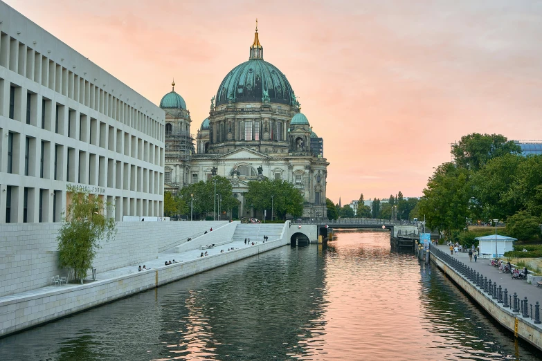 view of buildings, buildings, water and sky from a bridge