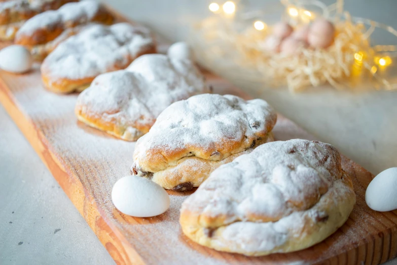 there are many cookies covered in icing on a board