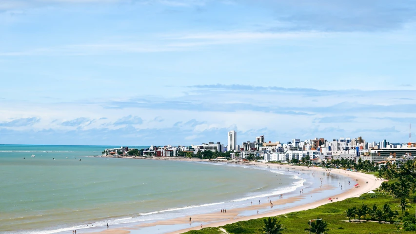 beach view with ocean and buildings in the distance