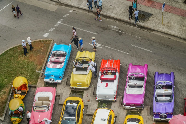 a lot full of different colored cars that are parked in the parking lot