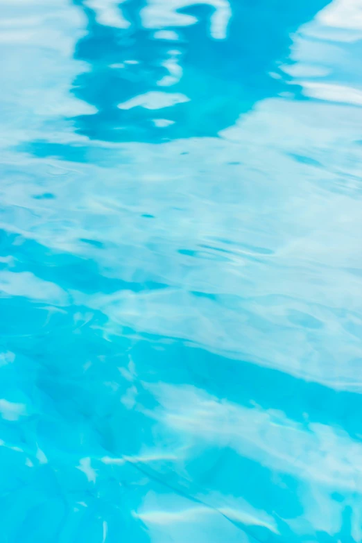 a person in the water with a parasol