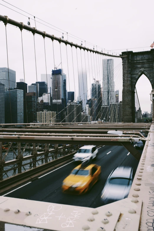 the bridge is very large and has many cars passing over it