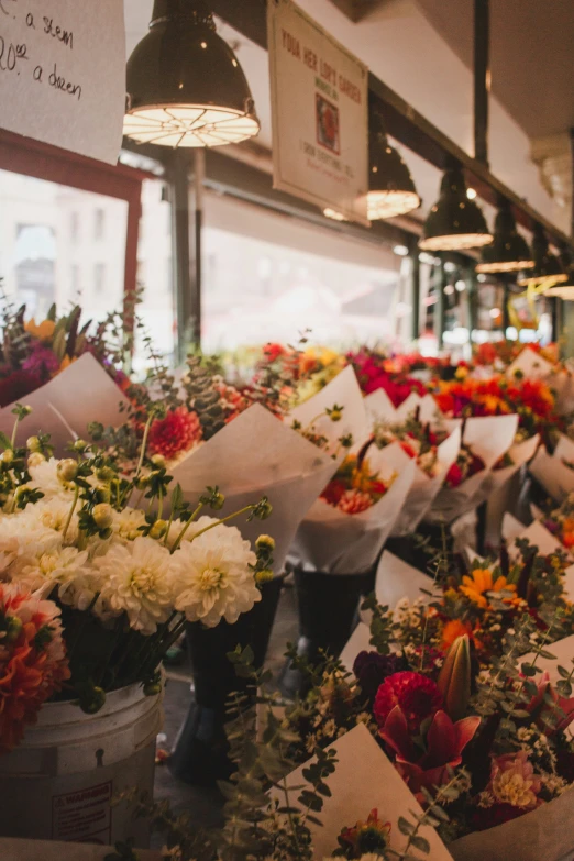 flower arrangements at an outdoor flower shop are arranged